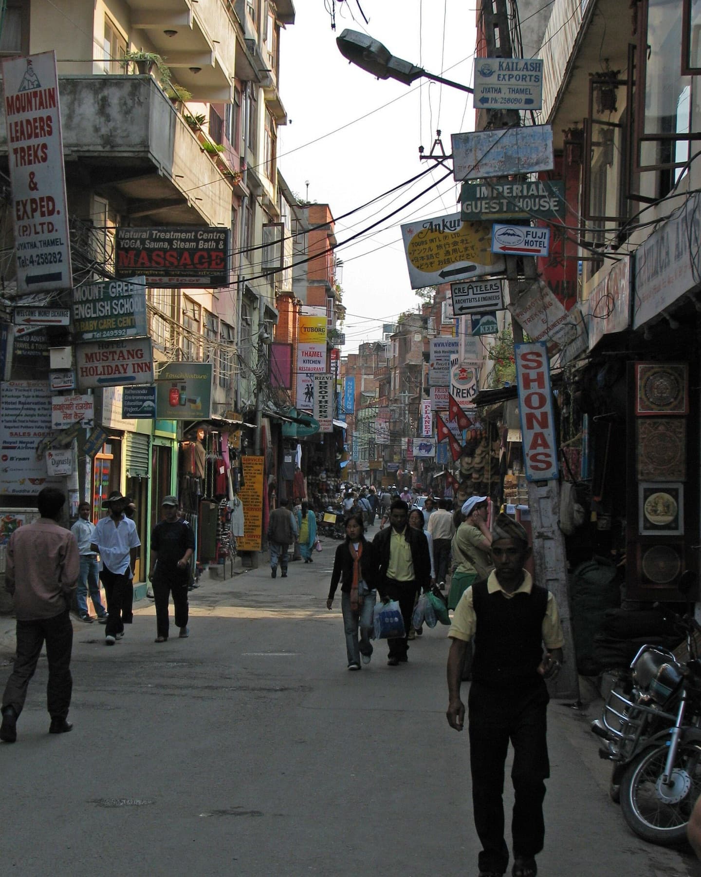 Shop signboards crowding a street in Thamel, Kathmandu, several reading “(P) Ltd.”